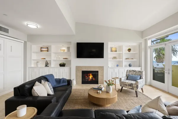 a living room with furniture fireplace and a flat screen tv