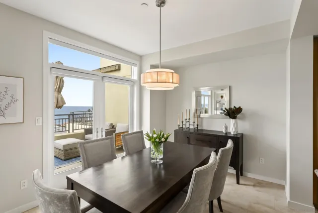 a view of a dining room with furniture window and outside view