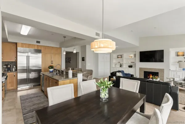 a living room with fireplace furniture and a flat screen tv