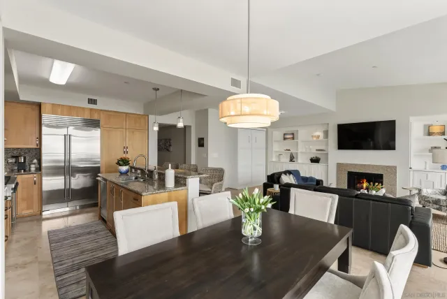 a living room with fireplace furniture and a flat screen tv