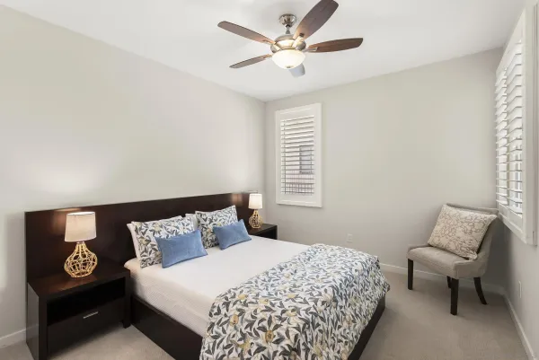 a bedroom with a bed and a couch