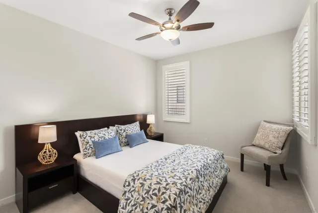 a bedroom with a bed and a couch