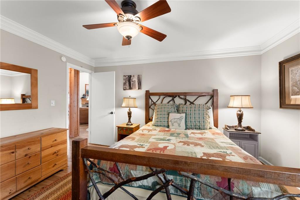 28 Little Hendricks Mountain Road Jasper, GA 30143 - Photo 14 of 50 a bedroom with a bed and a table in it