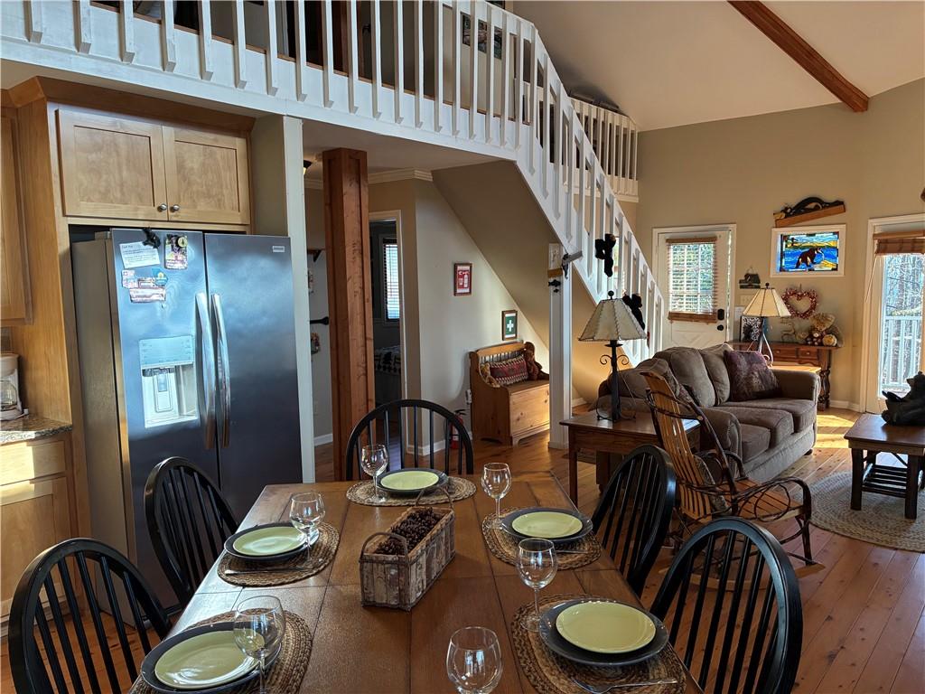 28 Little Hendricks Mountain Road Jasper, GA 30143 - Photo 17 of 42 a dining room with furniture a rug and wooden floor