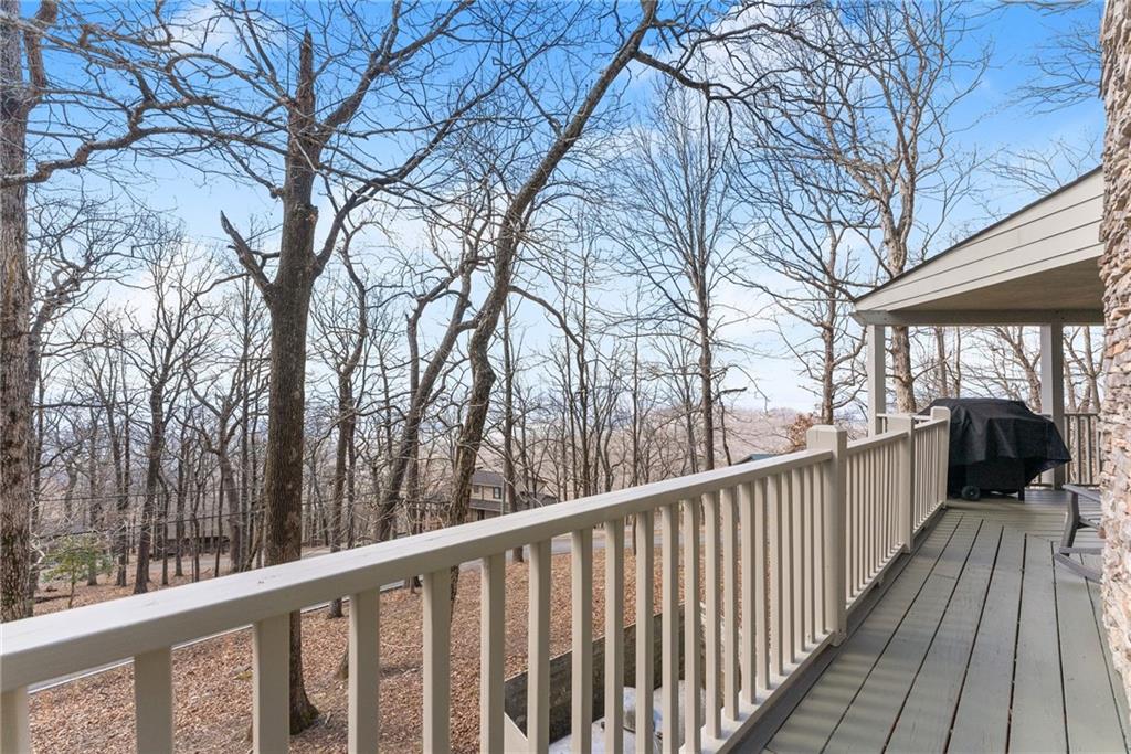 28 Little Hendricks Mountain Road Jasper, GA 30143 - Photo 21 of 50 a view of a balcony with wooden fence and floor