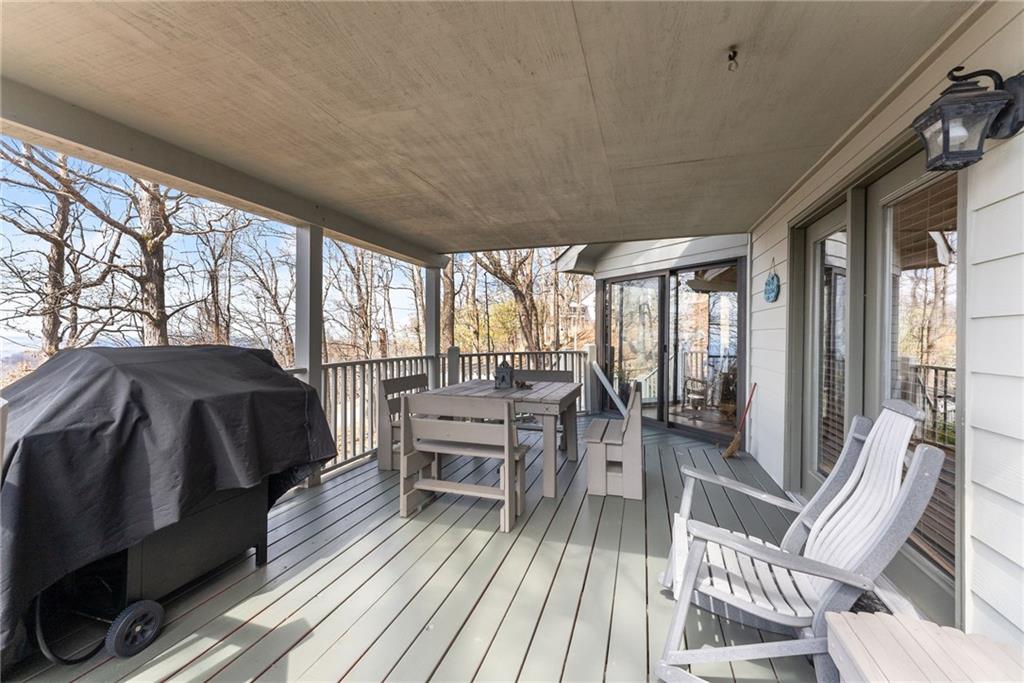 28 Little Hendricks Mountain Road Jasper, GA 30143 - Photo 22 of 50 a balcony with chairs and wooden floor