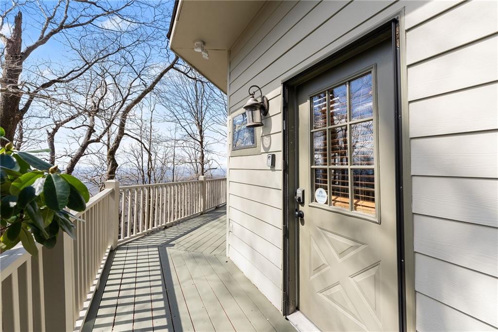 28 Little Hendricks Mountain Road Jasper, GA 30143 - Photo 23 of 50 a view of a balcony with wooden floor