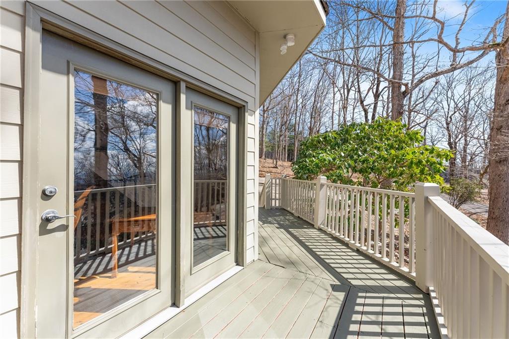 28 Little Hendricks Mountain Road Jasper, GA 30143 - Photo 26 of 50 a view of a balcony with wooden floor and fence