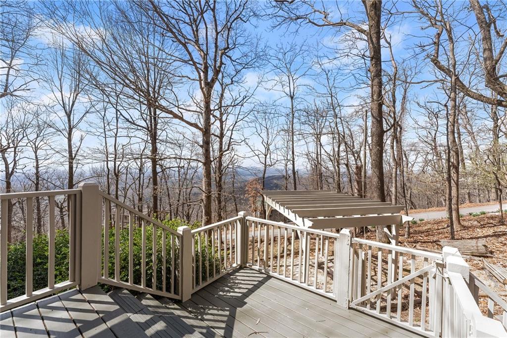 28 Little Hendricks Mountain Road Jasper, GA 30143 - Photo 27 of 50 a view of a house with large trees and wooden fence