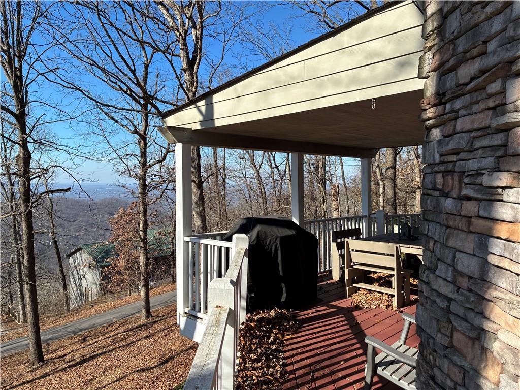 28 Little Hendricks Mountain Road Jasper, GA 30143 - Photo 41 of 42 a view of a patio with table and chairs and wooden floor