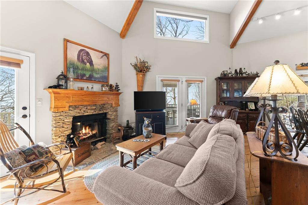 28 Little Hendricks Mountain Road Jasper, GA 30143 - Photo 7 of 50 a living room with furniture a flat screen tv and a fireplace