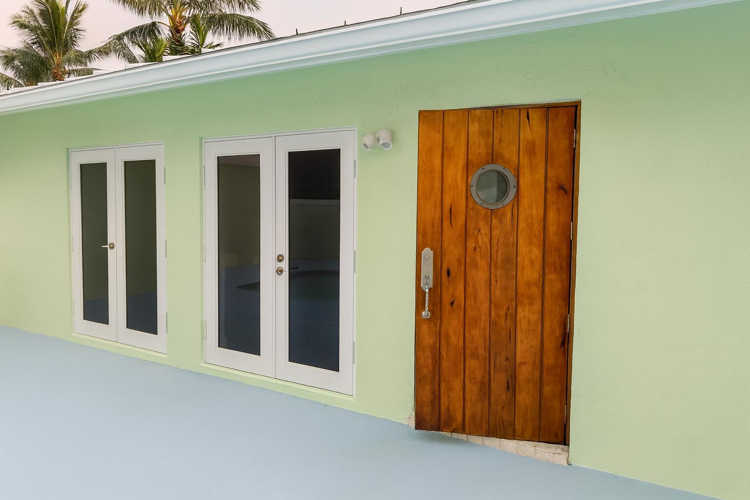 810 Bamboo Lane Delray Beach, FL 33483 - Photo 13 of 30 a front view of a house with door and balcony