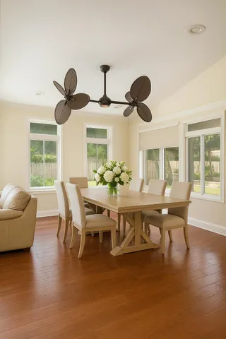 a dining room with furniture and window