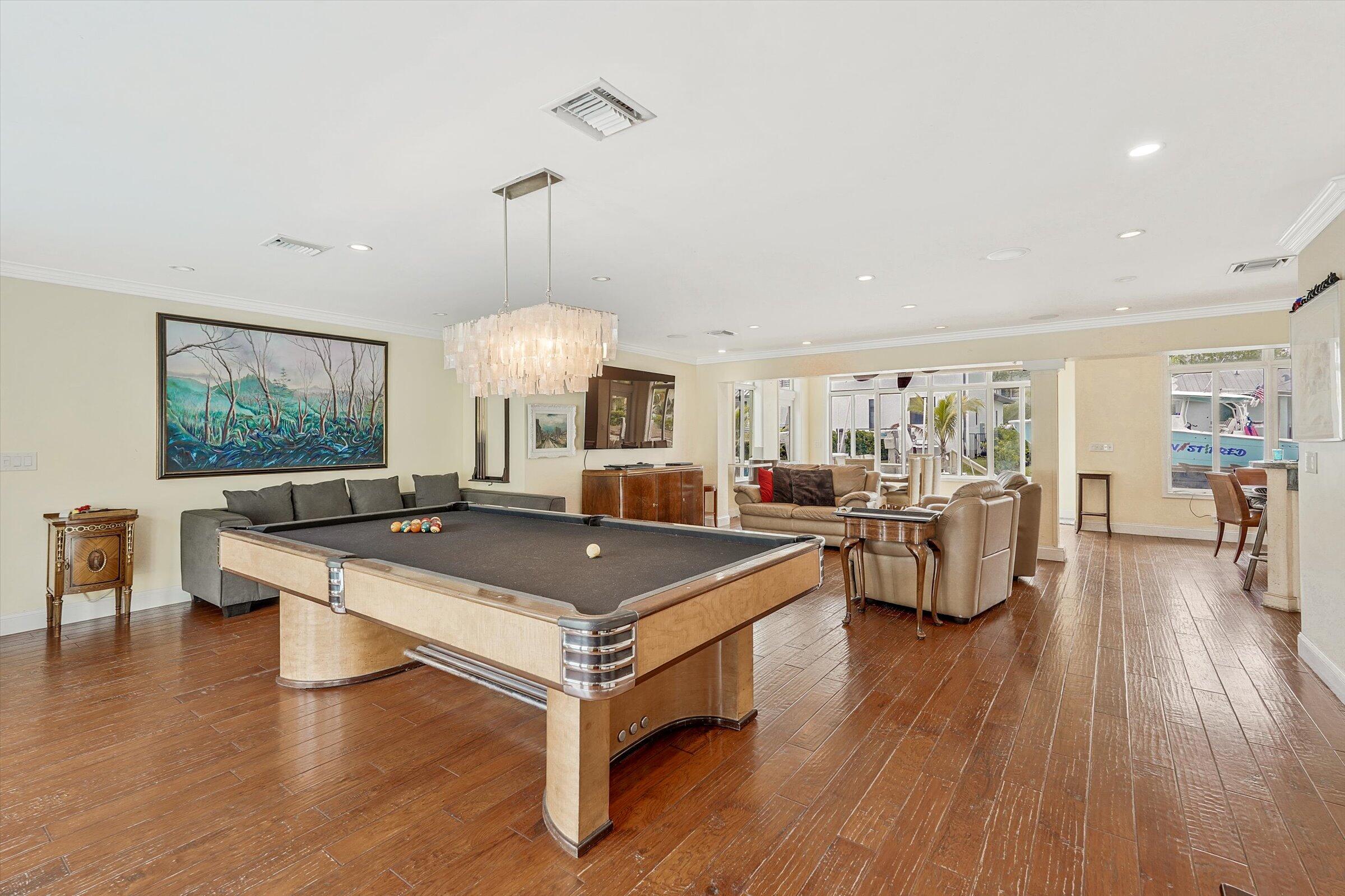 810 Bamboo Lane Delray Beach, FL 33483 - Photo 19 of 30 a view of a dining room with furniture window and wooden floor