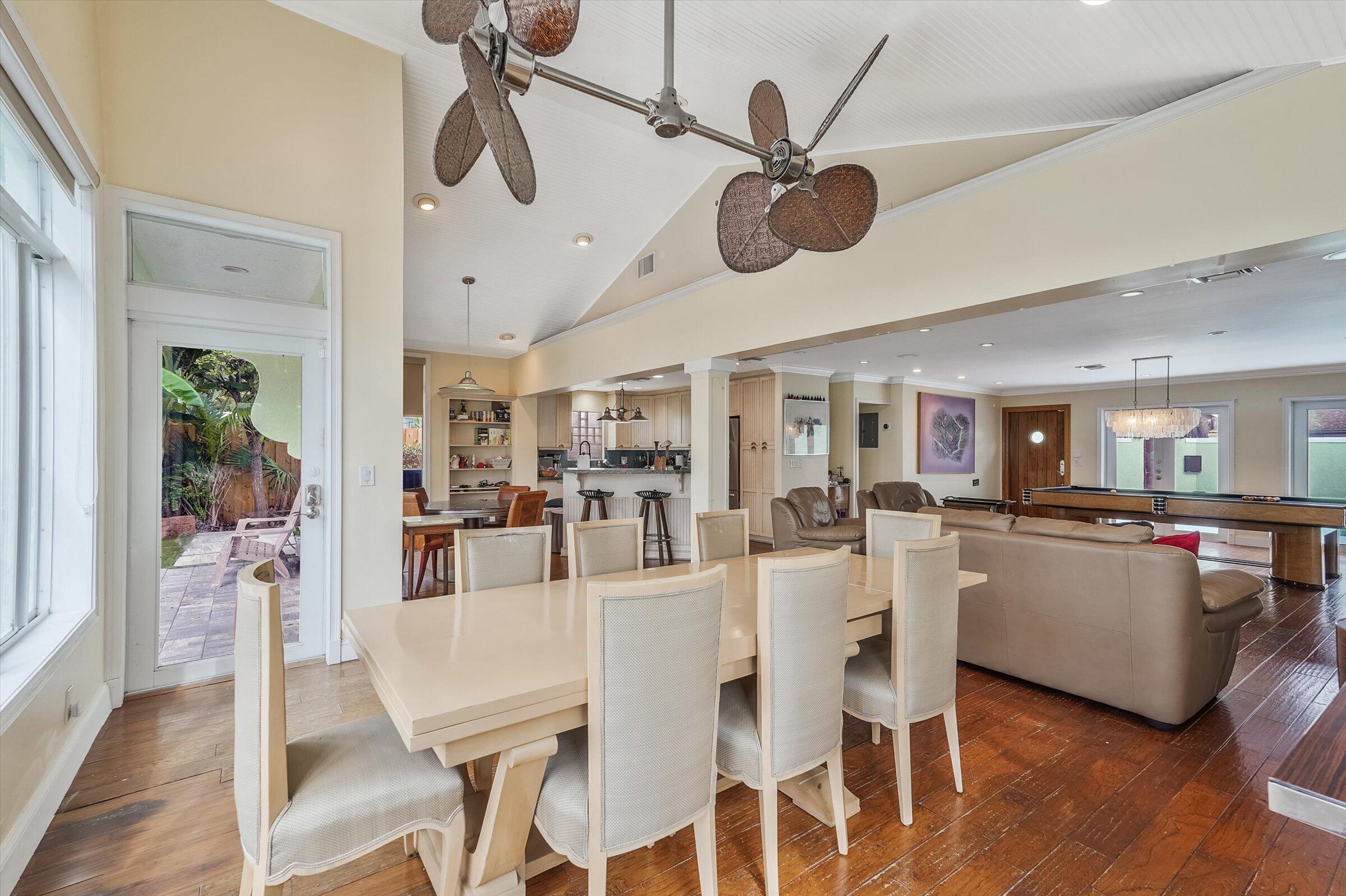 810 Bamboo Lane Delray Beach, FL 33483 - Photo 21 of 30 a view of a dining room and livingroom with furniture wooden floor a chandelier