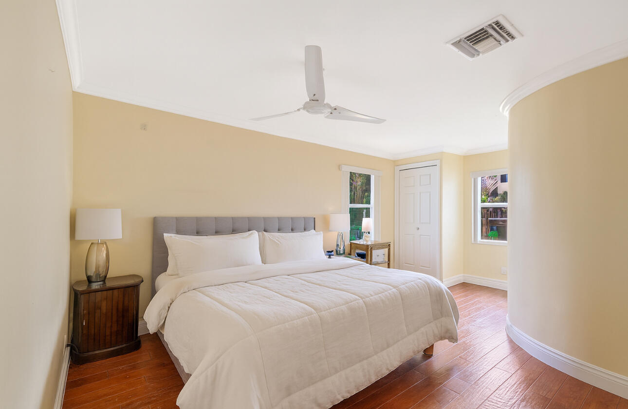 810 Bamboo Lane Delray Beach, FL 33483 - Photo 24 of 30 a bedroom with a bed and a window
