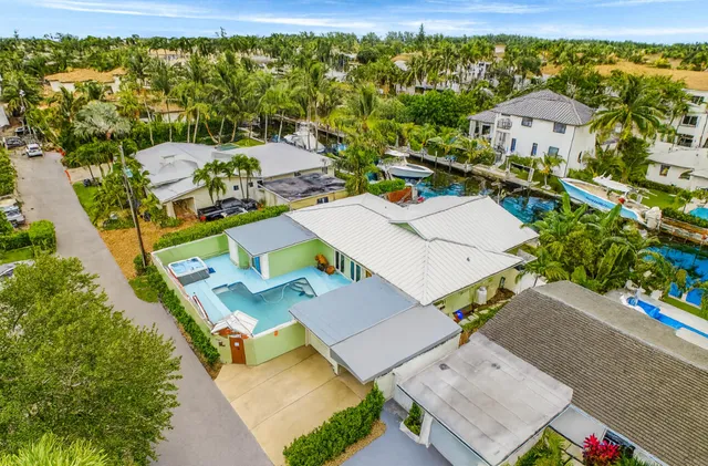 an aerial view of a house with a yard