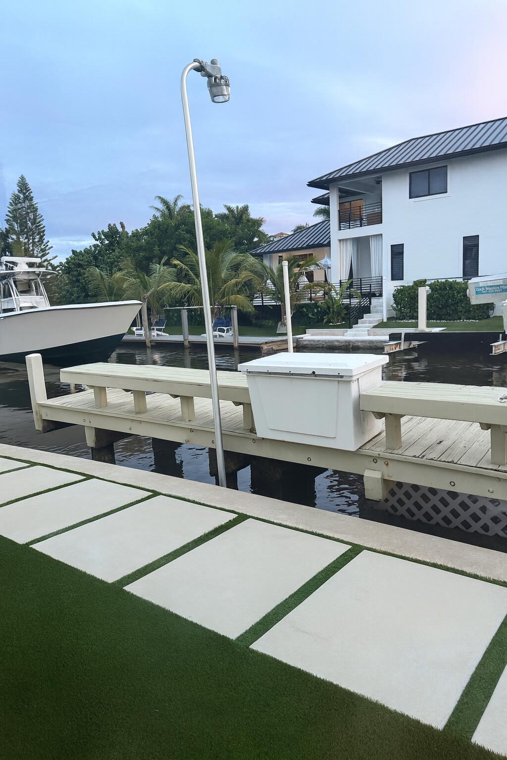 810 Bamboo Lane Delray Beach, FL 33483 - Photo 7 of 30 a view of a house with pool and chairs