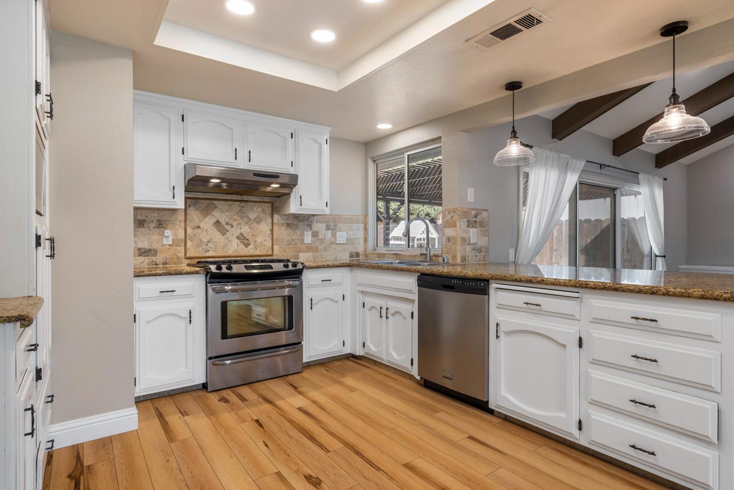 3317 Shamrock Avenue Merced, CA 95340 - Photo 13 of 44 a kitchen with a stove oven and sink