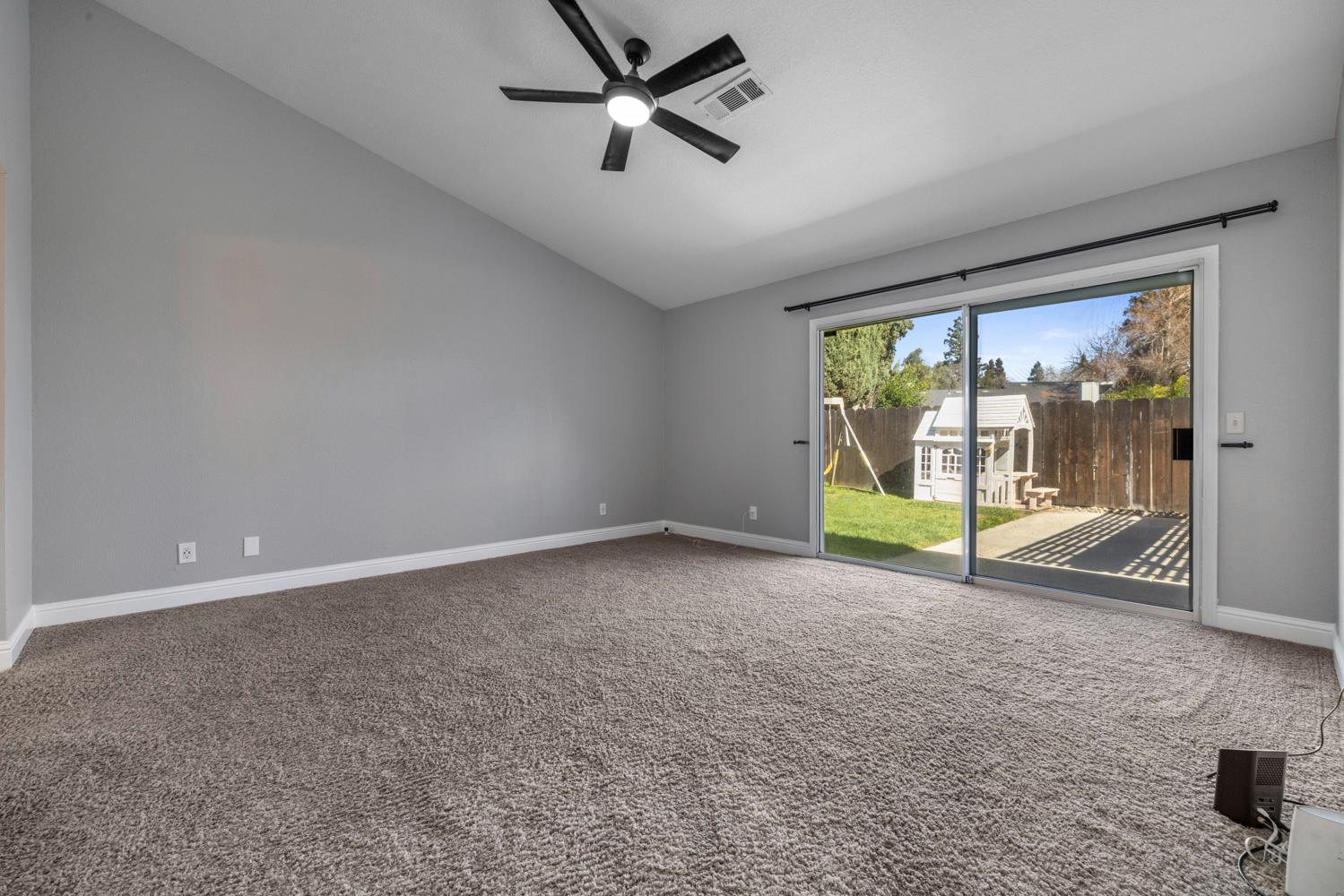 3317 Shamrock Avenue Merced, CA 95340 - Photo 26 of 44 an empty room with sliding door