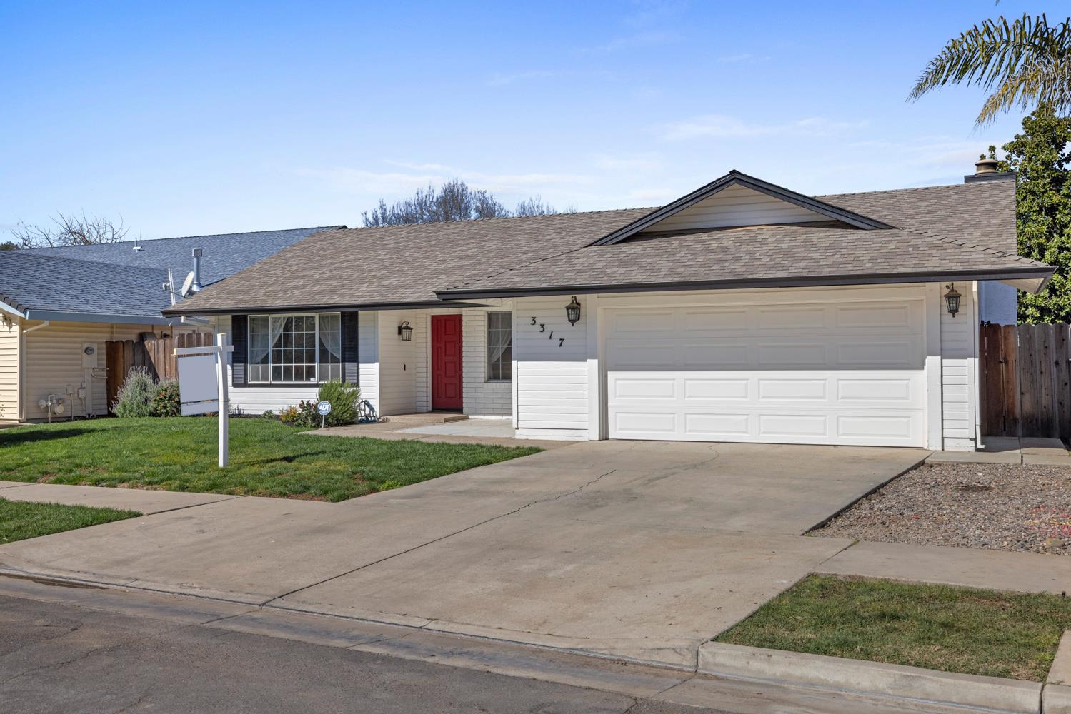 3317 Shamrock Avenue Merced, CA 95340 - Photo 3 of 44 front view of a house with a yard