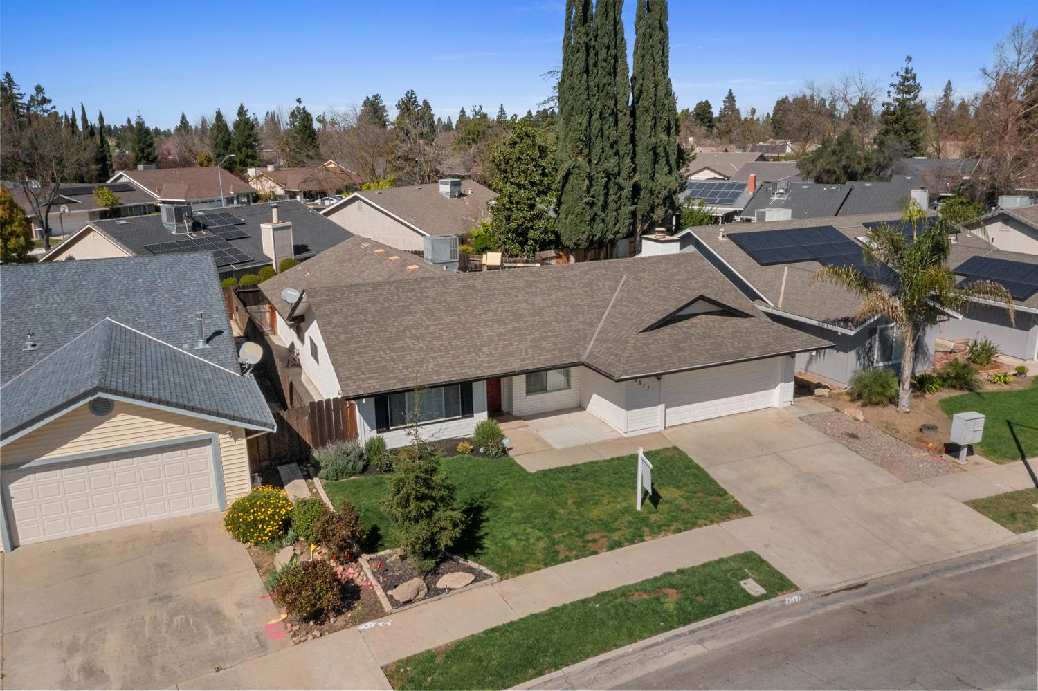 3317 Shamrock Avenue Merced, CA 95340 - Photo 35 of 44 a aerial view of a house with a yard and a garage