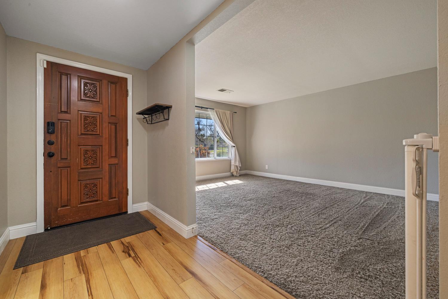 3317 Shamrock Avenue Merced, CA 95340 - Photo 6 of 44 a view of empty room with wooden floor