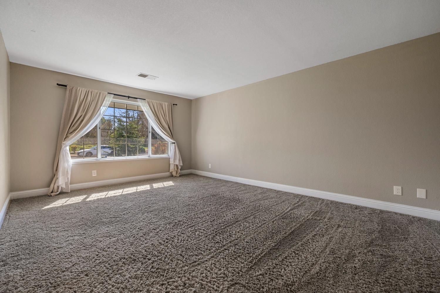 3317 Shamrock Avenue Merced, CA 95340 - Photo 7 of 44 an empty room with large windows
