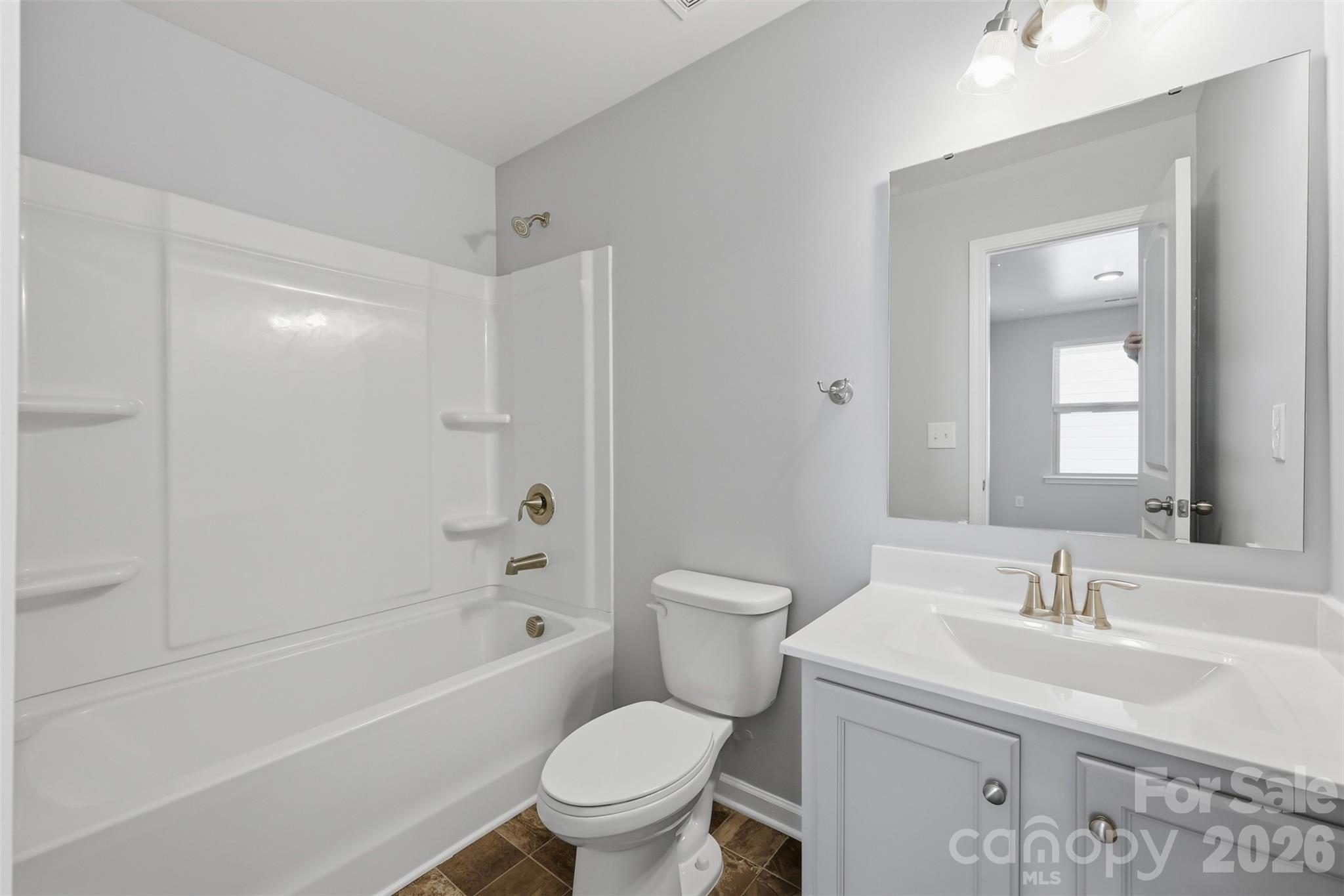 2220 Sussex Road York, SC 29745 - Photo 19 of 42 a bathroom with a sink toilet vanity and shower