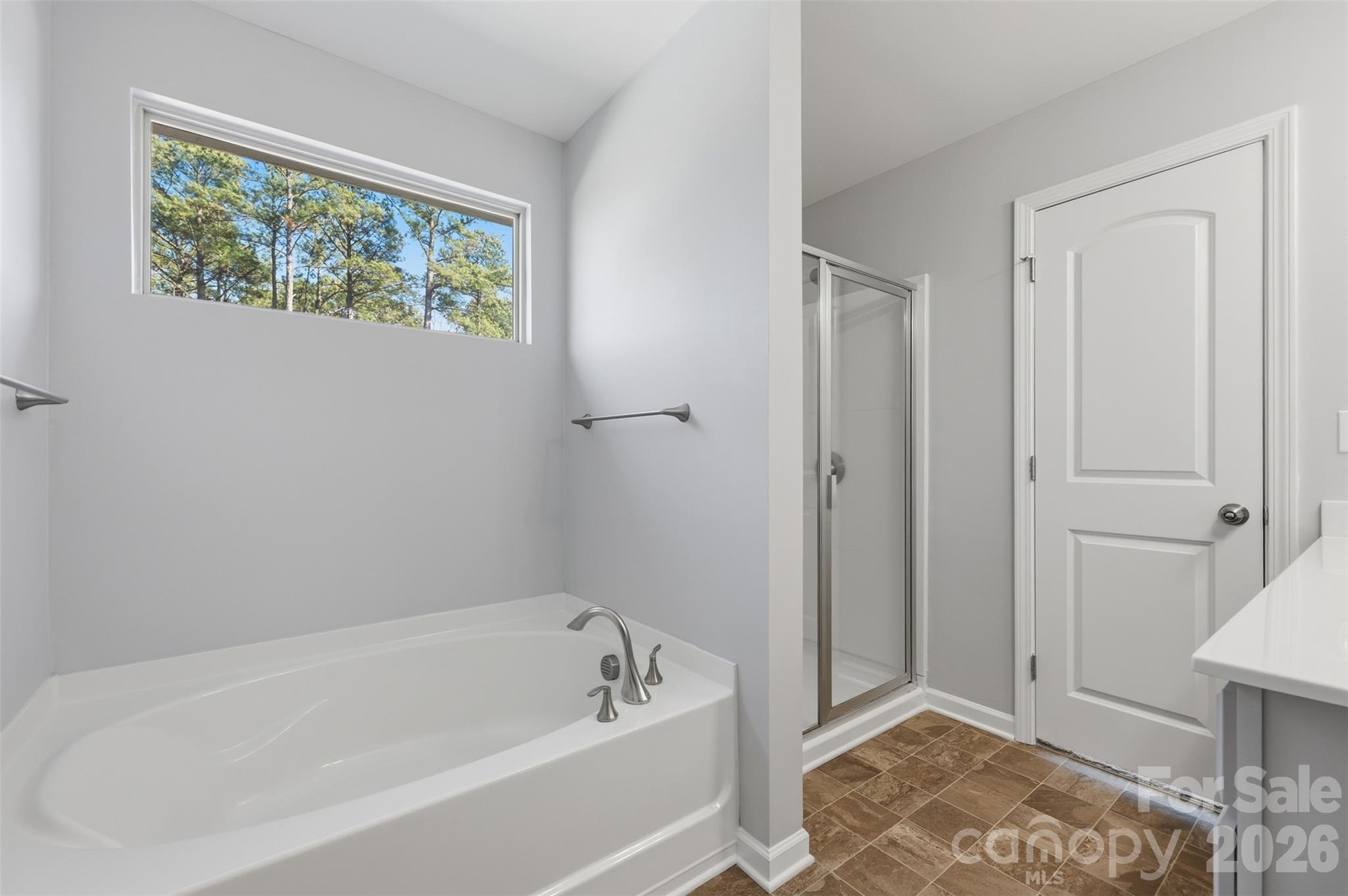 2220 Sussex Road York, SC 29745 - Photo 23 of 42 a bathroom with a bathtub and a window