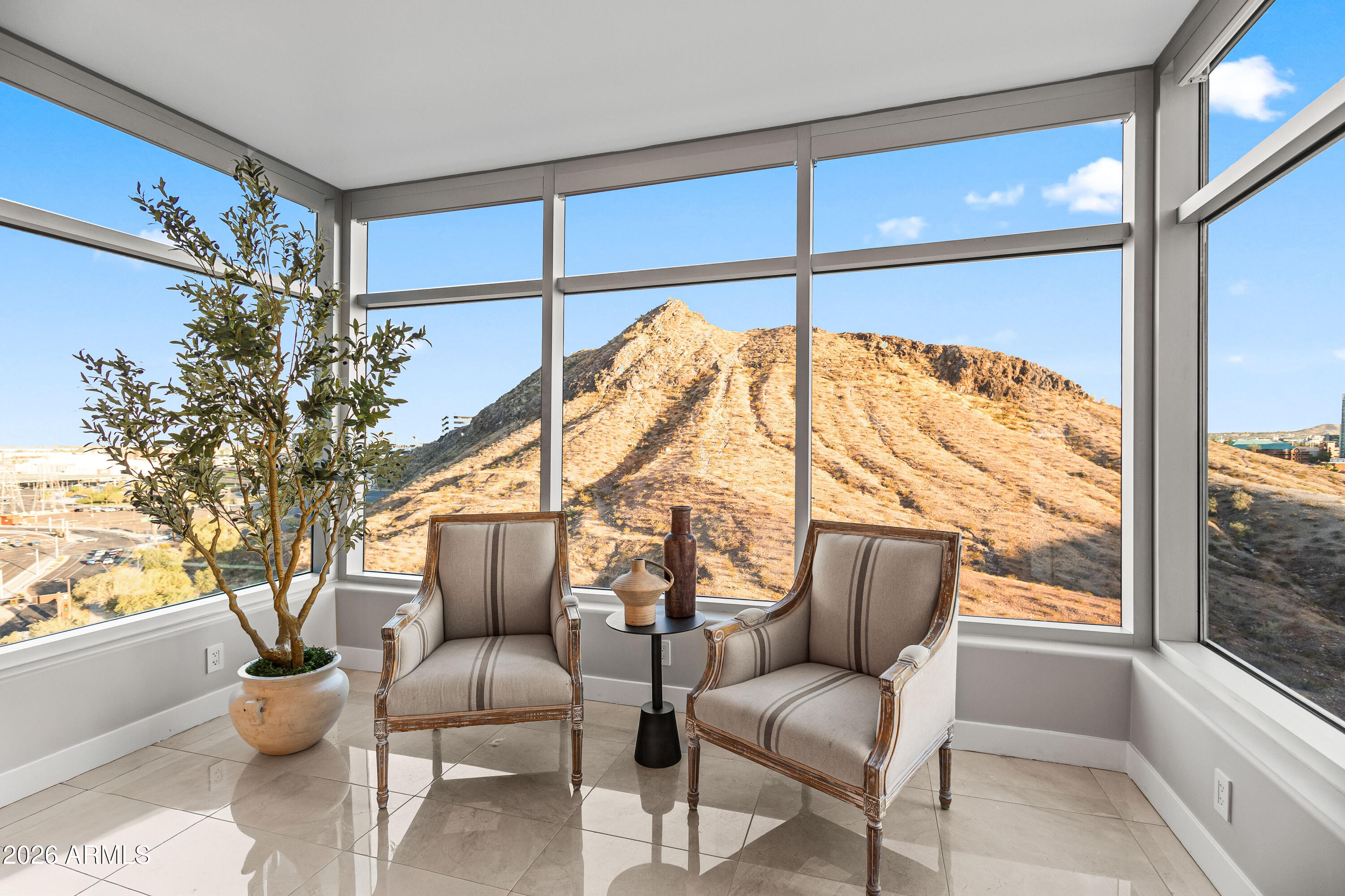 140 East Rio Salado Parkway, Unit 1101 Tempe, AZ 85281 - Photo 2 of 32 a balcony with furniture and a potted plant