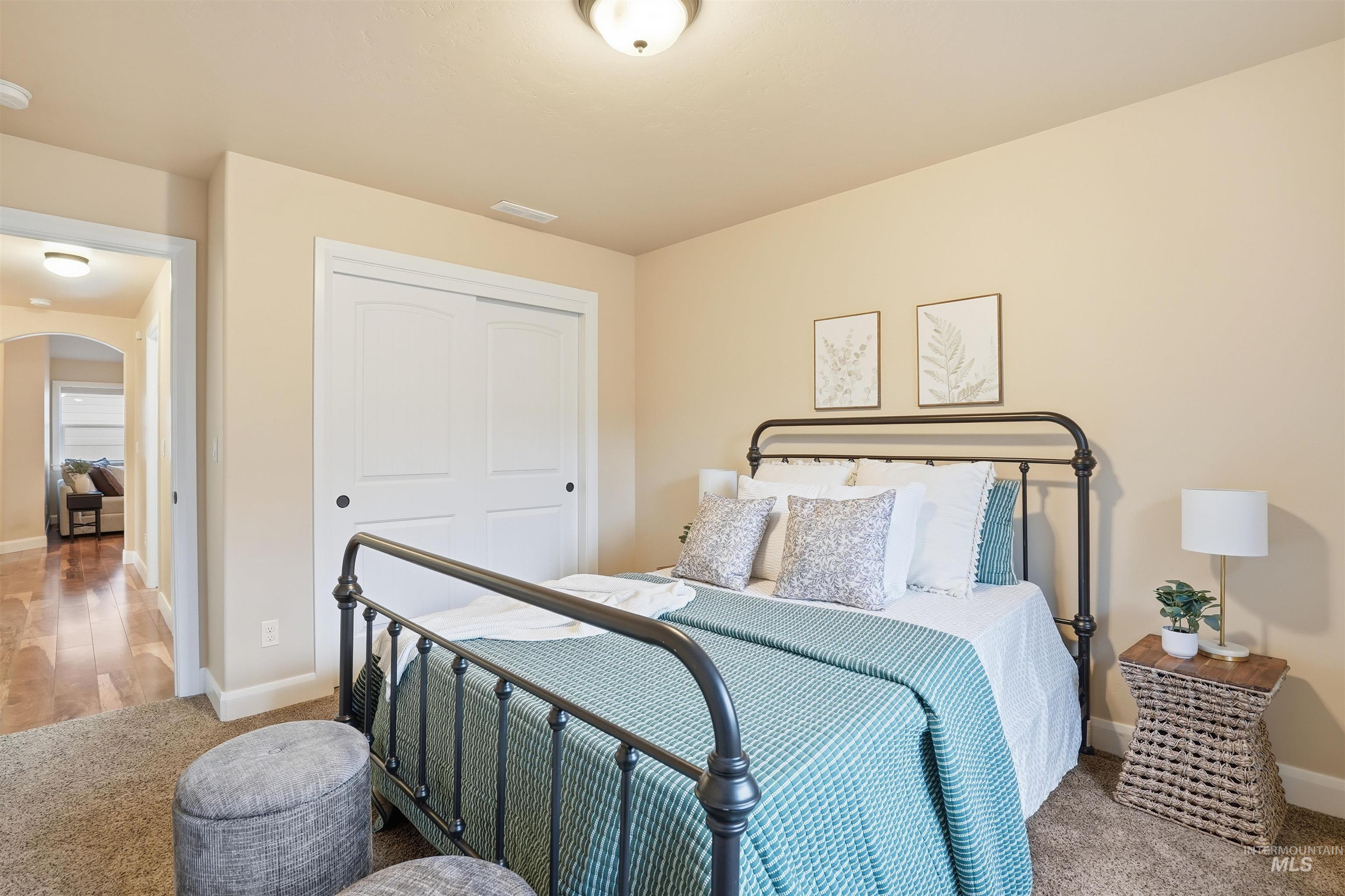 5697 Combermere Drive Eagle, ID 83616 - Photo 23 of 43 Carpeted bedroom featuring arched walkways and a closet