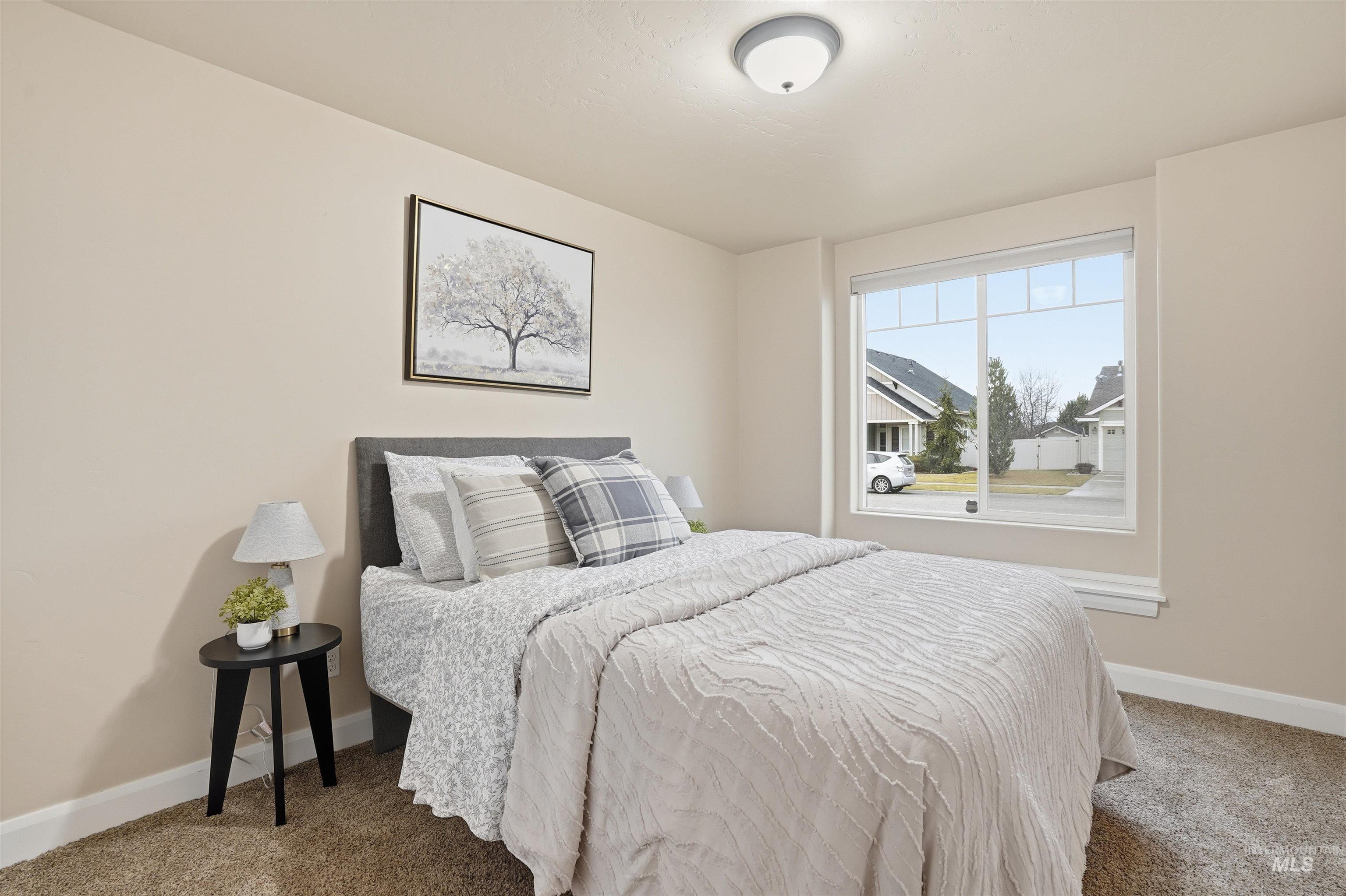 5697 Combermere Drive Eagle, ID 83616 - Photo 25 of 43 Carpeted bedroom featuring baseboards