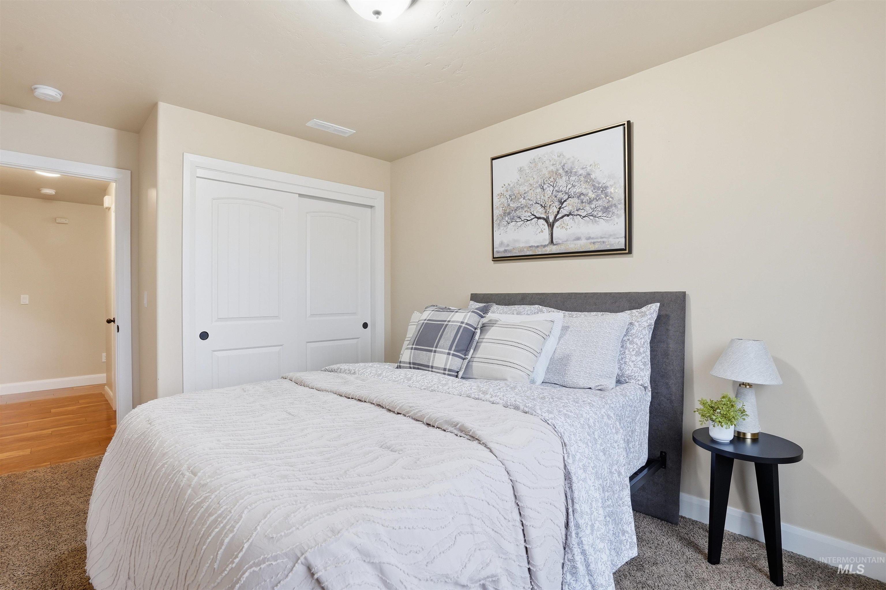 5697 Combermere Drive Eagle, ID 83616 - Photo 26 of 43 Bedroom with light colored carpet and a closet