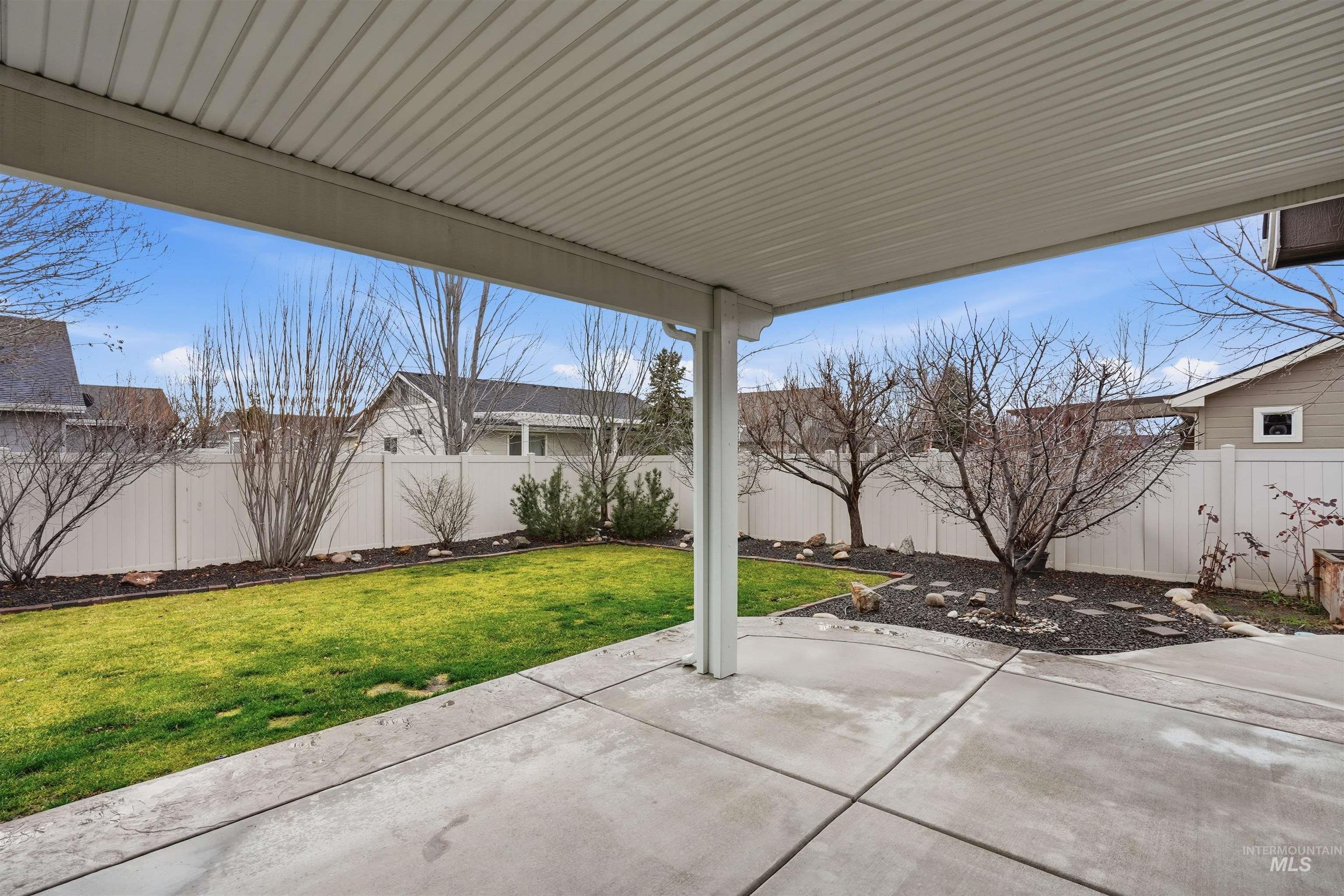 5697 Combermere Drive Eagle, ID 83616 - Photo 35 of 43 Fenced backyard with a patio