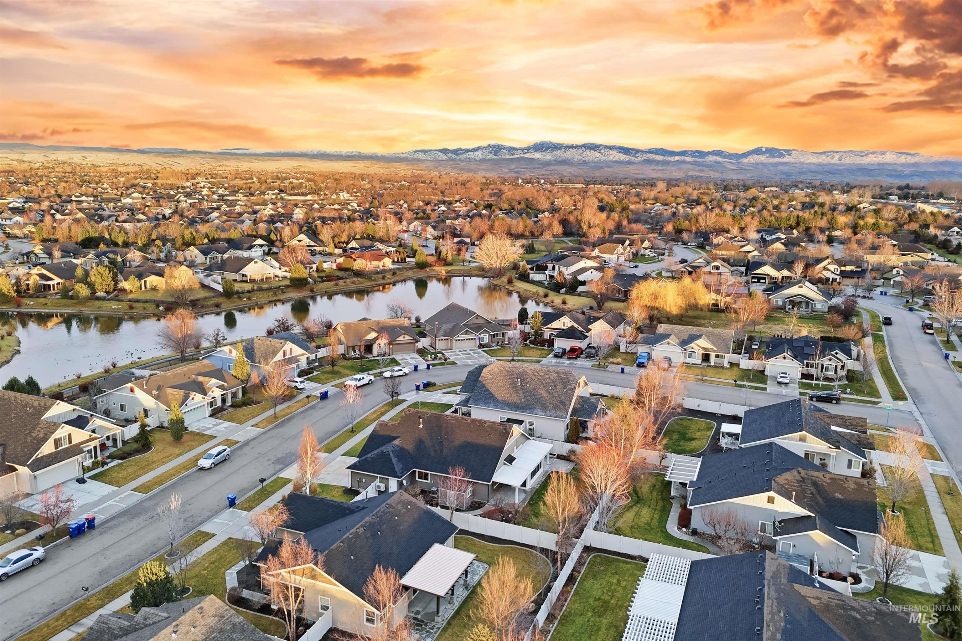 5697 Combermere Drive Eagle, ID 83616 - Photo 4 of 43 Aerial view of property and surrounding area with nearby suburban area