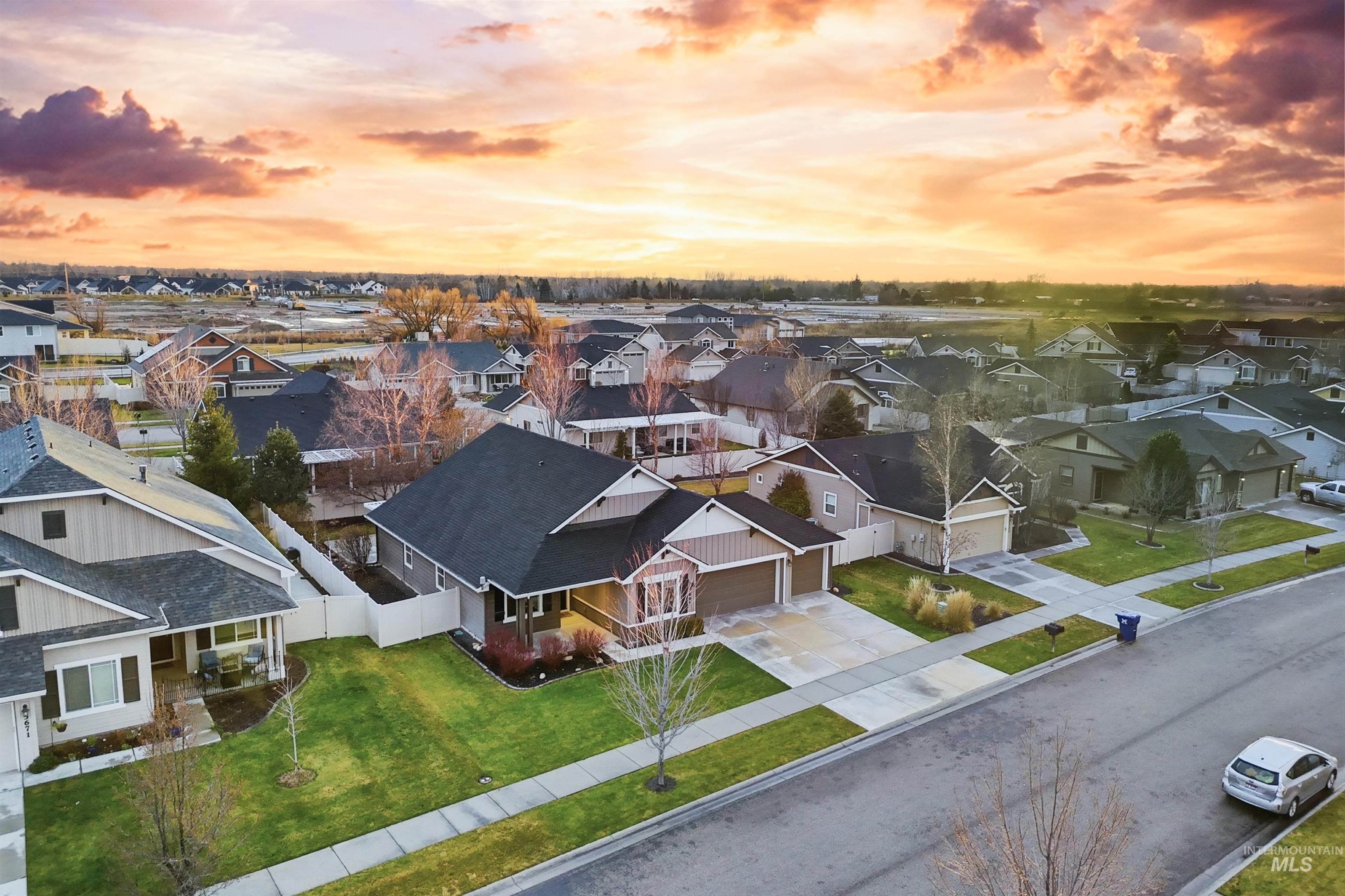 5697 Combermere Drive Eagle, ID 83616 - Photo 41 of 43 Aerial view at dusk of a residential view
