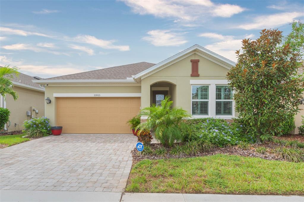 Restricted Address Lithia, FL 33547 - Photo 1 of 47 a front view of house with yard and green space