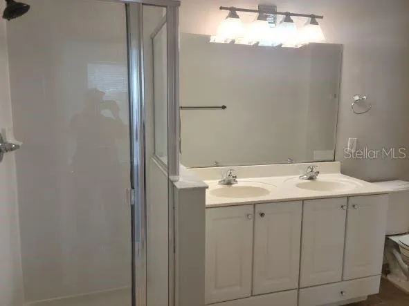 a bathroom with a sink and mirror