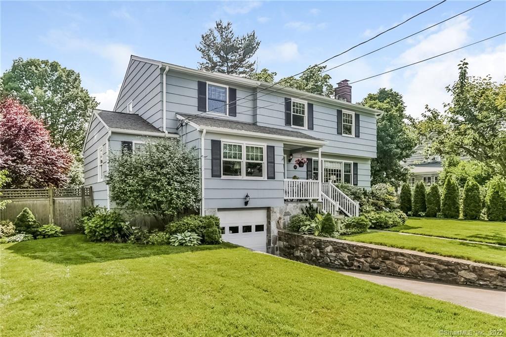 360 South Benson Road Fairfield, CT 06824 - Photo 1 of 1 a front view of a house with a garden