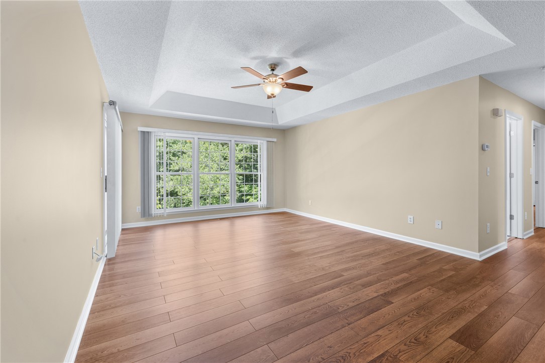 429 Burns Mill Road West Union, SC 29696 - Photo 16 of 49 A tray ceiling and rich hardwood floors create an inviting and elegant living space.