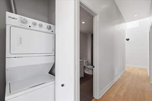 a view of walk in closet with white walls