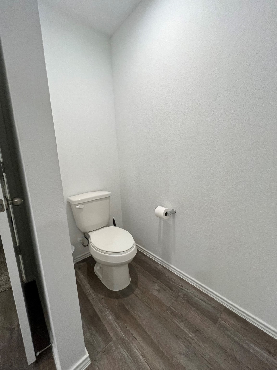 5446 Wyndham Ridge Ln Spring Spring, TX 77373 - Photo 11 of 24 a white toilet sitting next to a white cabinet