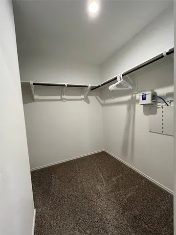 a view of a room with racks on the wall