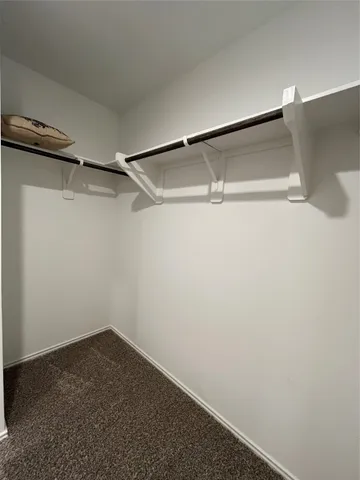 a view of a room with shelf on the wall