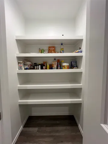 a view of room with racks on the wall