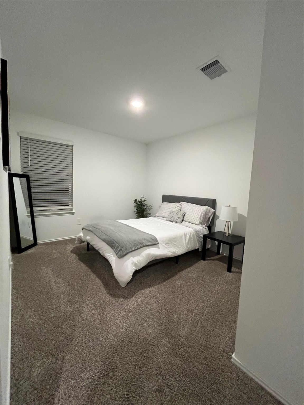 5446 Wyndham Ridge Ln Spring Spring, TX 77373 - Photo 19 of 24 a bedroom with a bed and a window