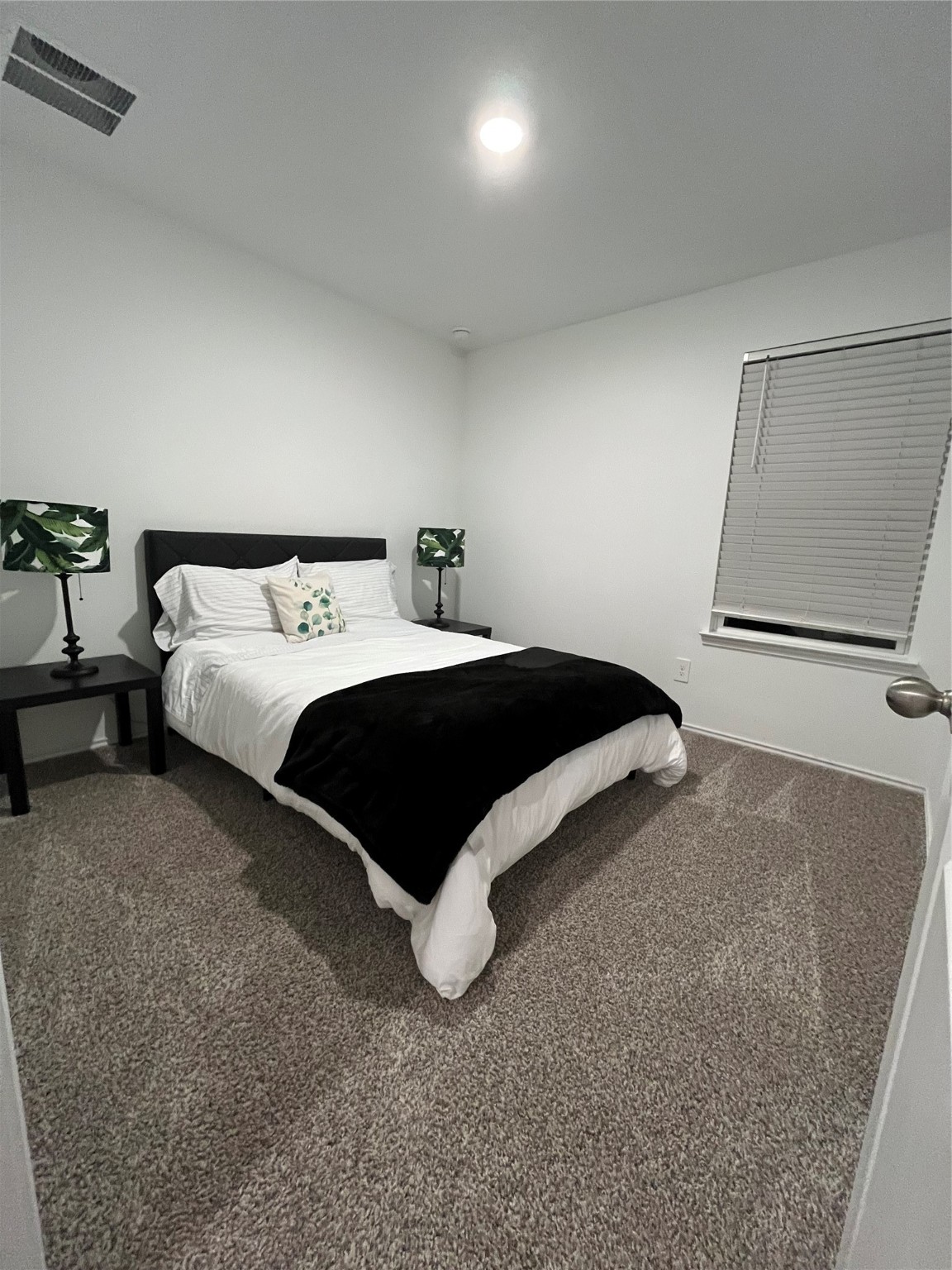 5446 Wyndham Ridge Ln Spring Spring, TX 77373 - Photo 21 of 24 a bedroom with a bed and a night stand