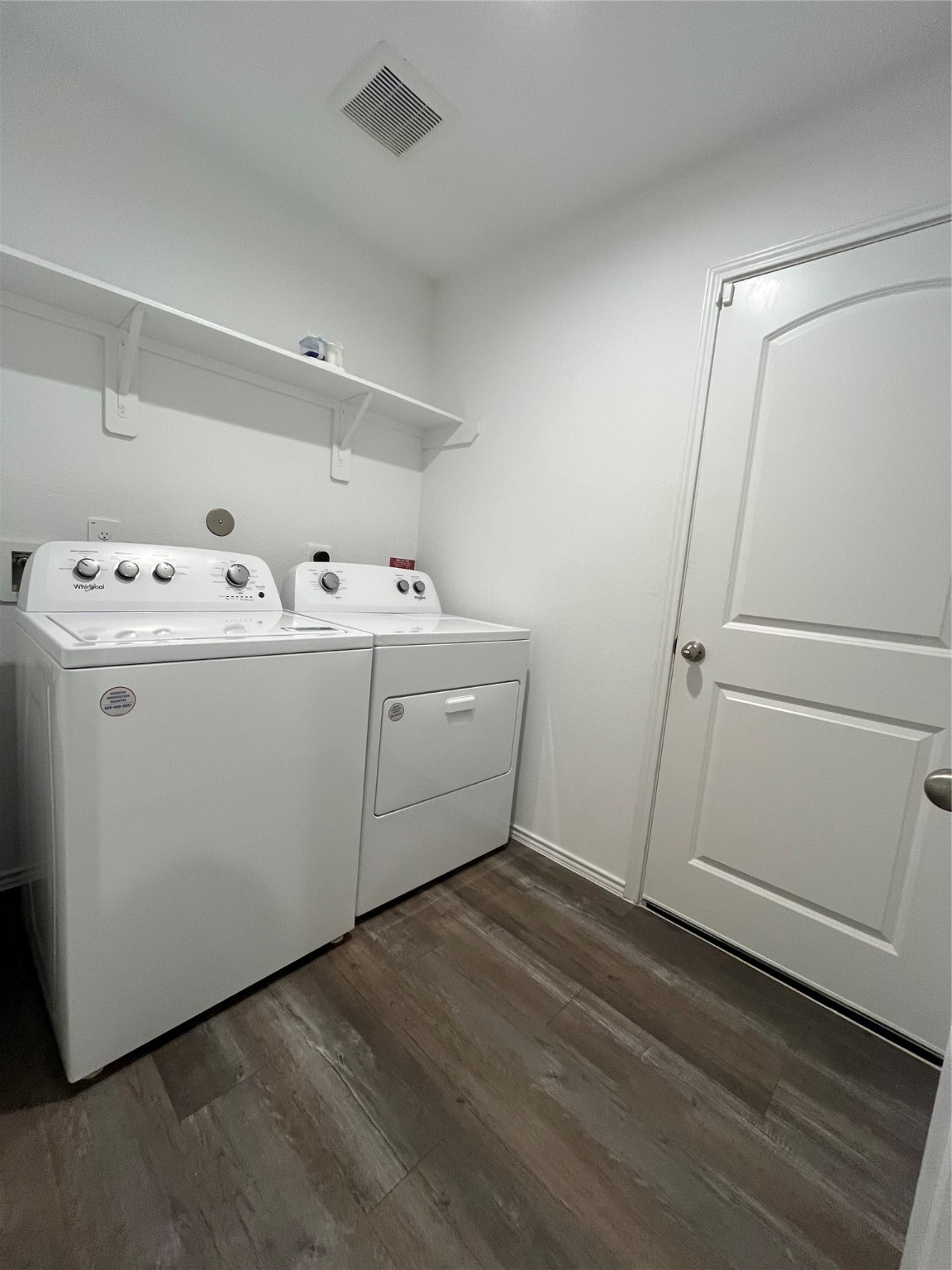 5446 Wyndham Ridge Ln Spring Spring, TX 77373 - Photo 4 of 24 a utility room with dryer and washer