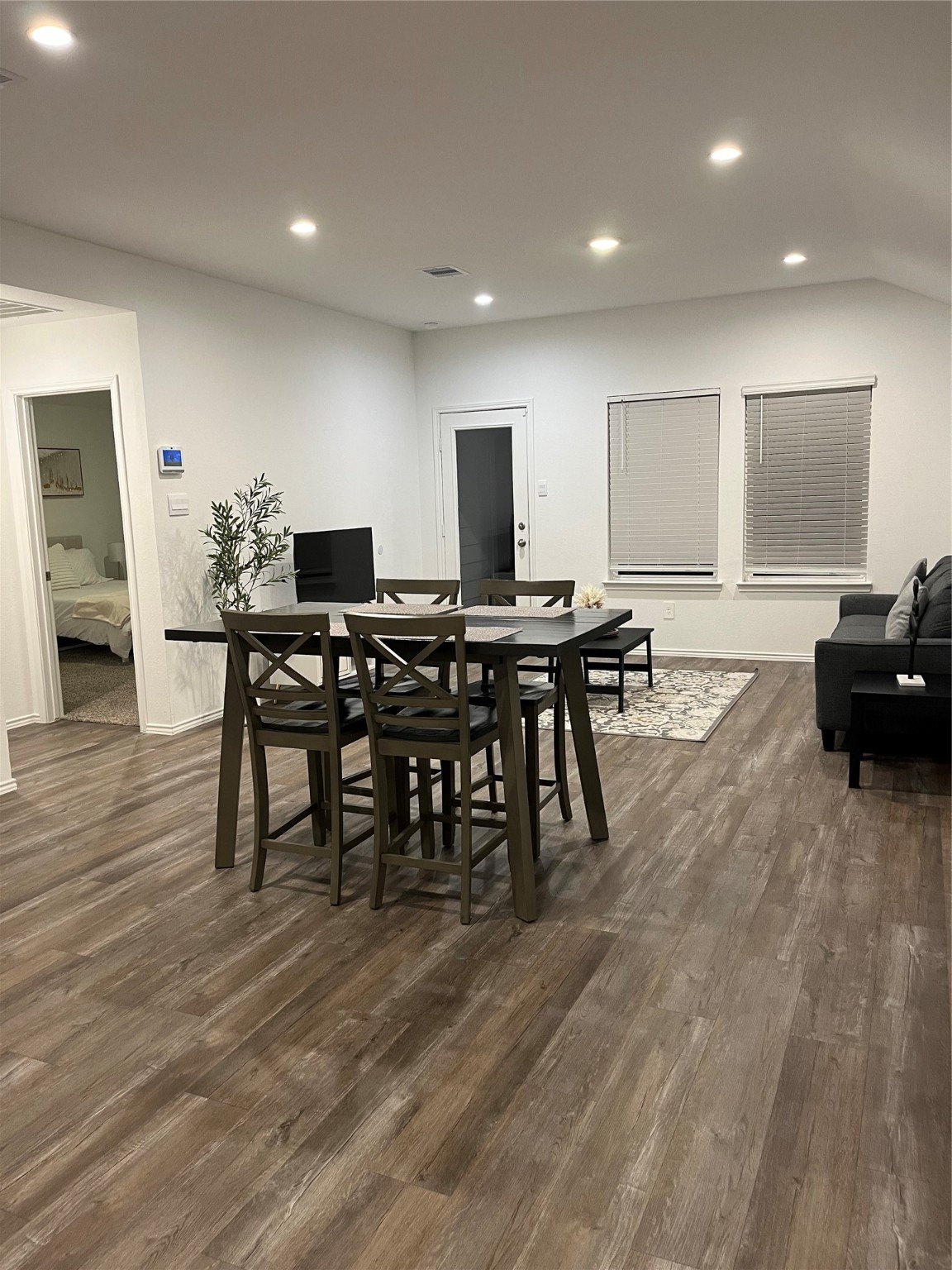 5446 Wyndham Ridge Ln Spring Spring, TX 77373 - Photo 7 of 24 a view of a a dining room with furniture window and wooden floor